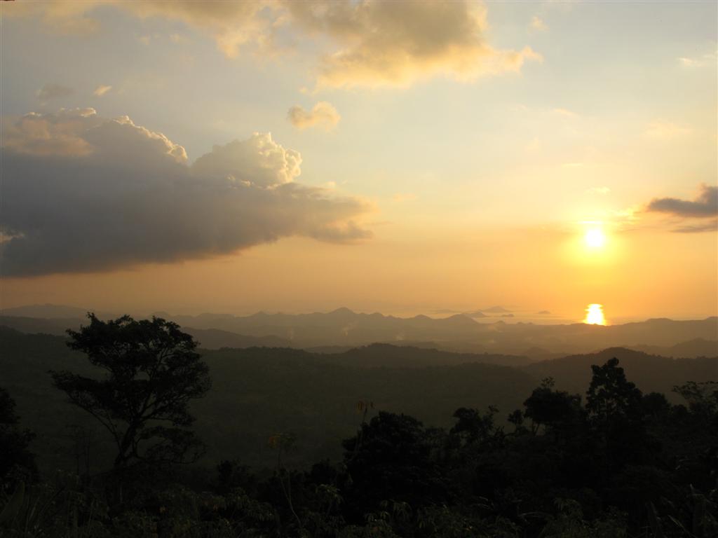 Sunset over the ridgelines toward Komodo National Park, seen from the summit of Mount Mbeliling