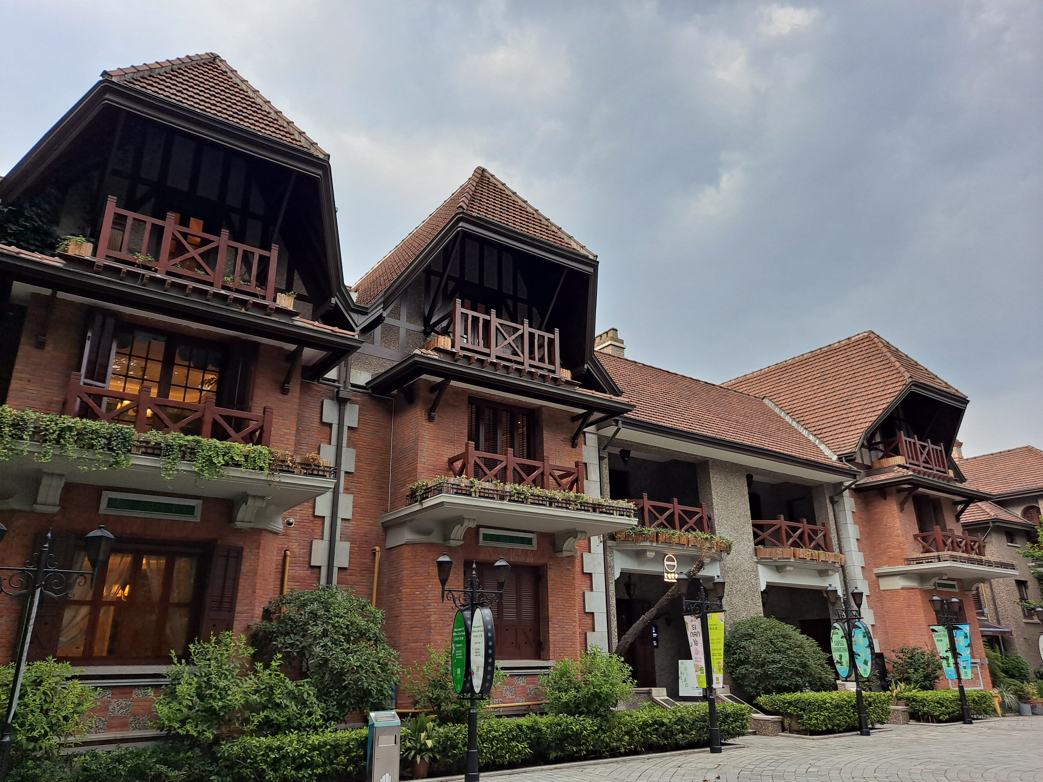 The half-timbered villas of Sinan Mansions in the former French Concession, warm under an evening sky