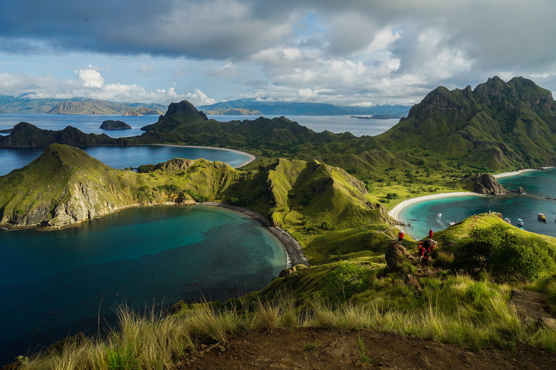 An aerial view of Padar Island in Komodo National Park, its ridged hills dropping to turquoise bays and pale beaches
